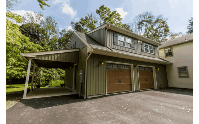 Craftsman-style two-car garage addition with attached carport and large shed dormer