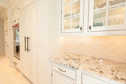 White kitchen with under-cabinet lighting design