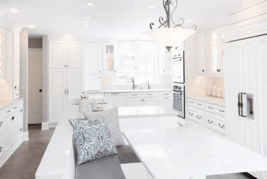 Classic remodeled white kitchen with large island and bench seating (1)