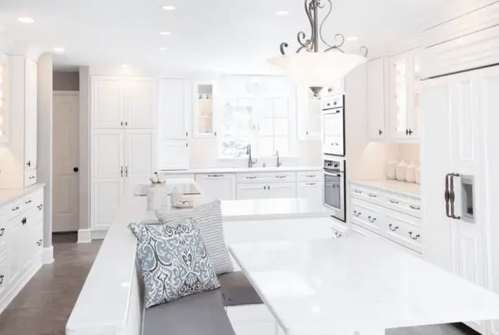 Classic_white_kitchen_with_white_table_bench_seating_and_white_cabinets