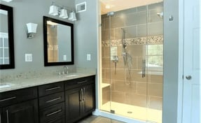 Remodeled_bathroom_with_dual_vanity_sink_and_glass_walk-in_shower_710x437 (1)